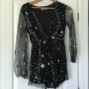Reverse black romper with silver sparkle stars